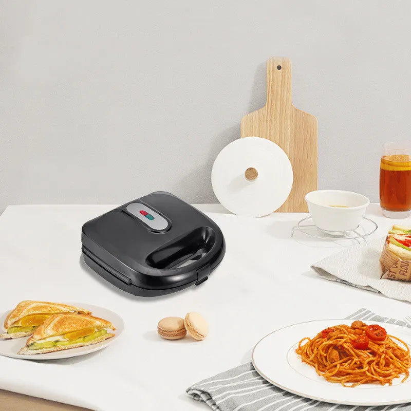Black double-sided electric sandwich pan with non-stick plates and brushed stainless steel lid
