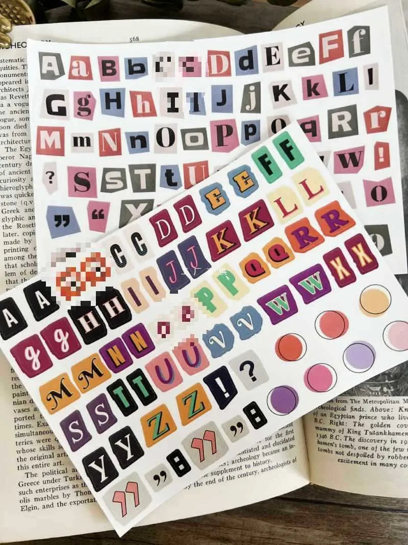 A set of cute-style decoration stickers showing printed English letters and weekly words like Monday, Tuesday.