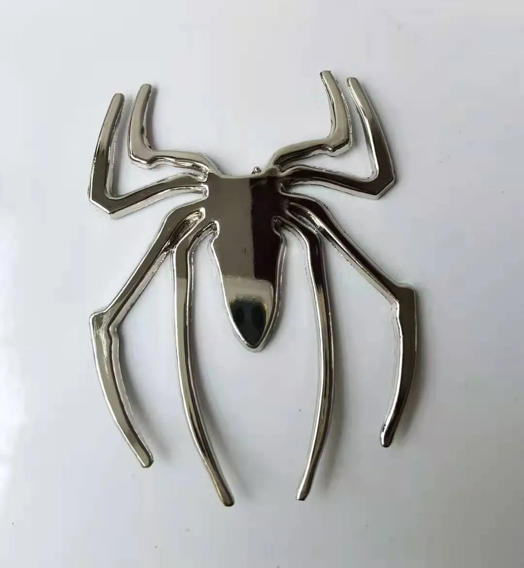 3D metallic spider bumper sticker in zinc alloy, shown in gold colour.