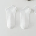 Men's low-cut solid colour polyester boat socks in six colour options with simple design