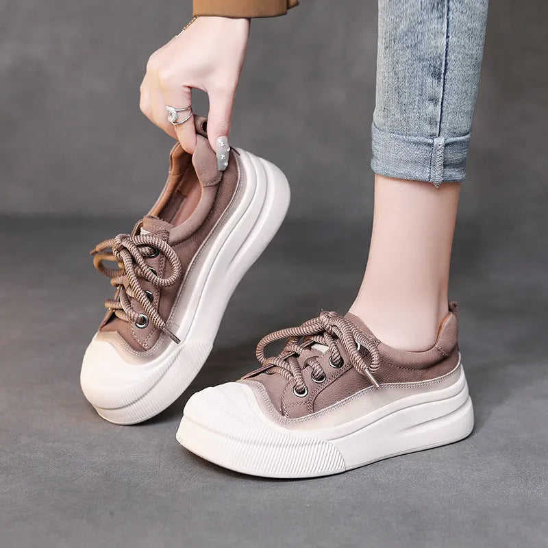 Yellow women's leather lace-up casual shoes with round toe on a plain background.