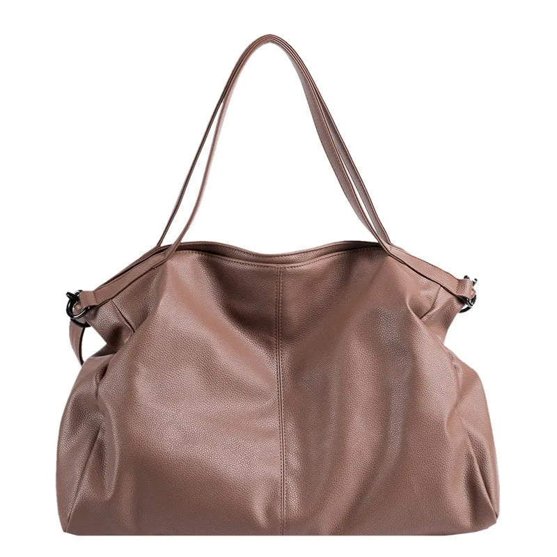 Large soft surface PU messenger bag in a horizontal square tote style with a shoulder strap.