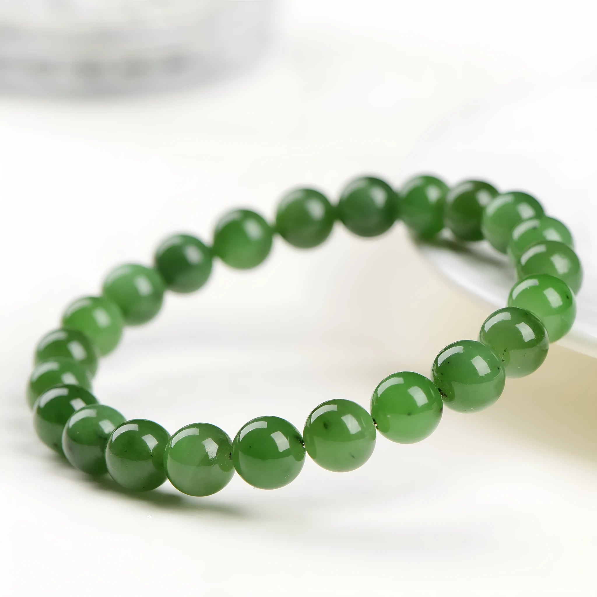 Natural jasper ball bracelet showing polished Hetian jade and jasper stone beads in one of five available sizes from 4mm to 12.8mm.