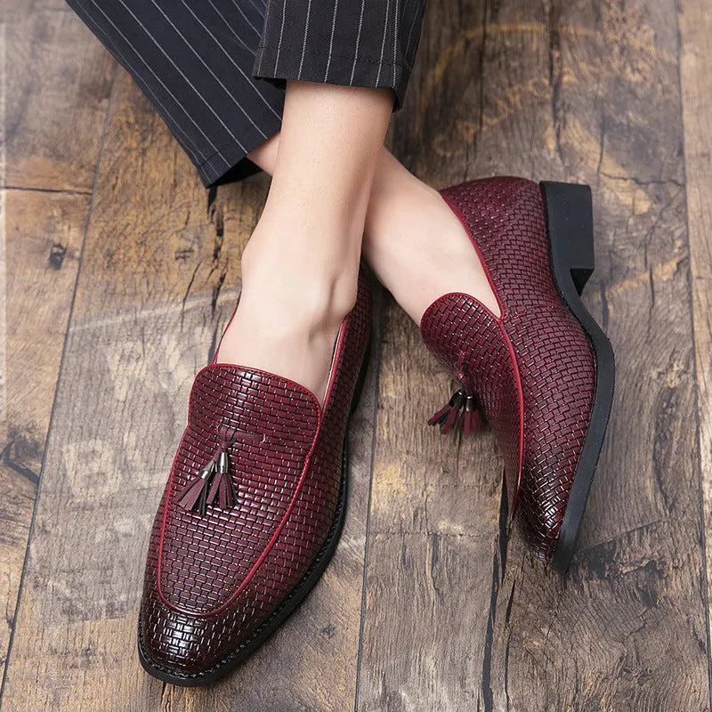 Men's black slip-on business shoes with pointed toe and tassel detail