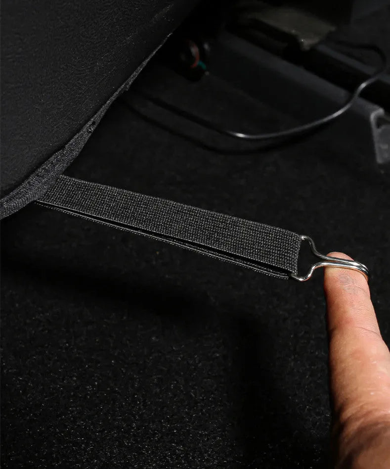 Black leather rear anti-kick pad for car seats, shown with dimensions 68cm long by 42cm wide.