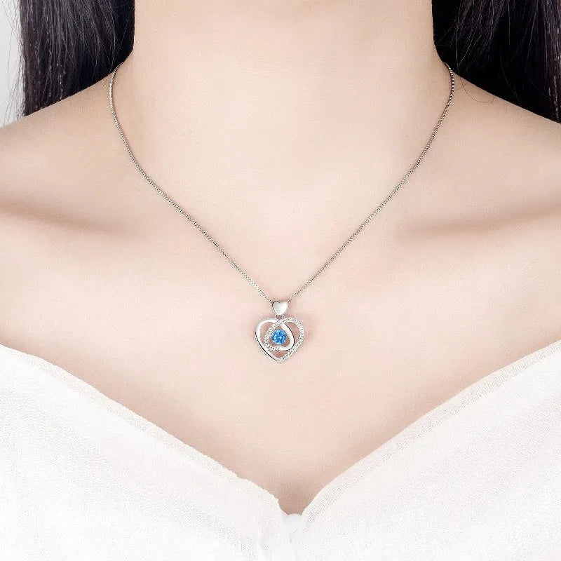 Blue diamond tone heart pendant necklace and matching bracelet set on a copper chain.