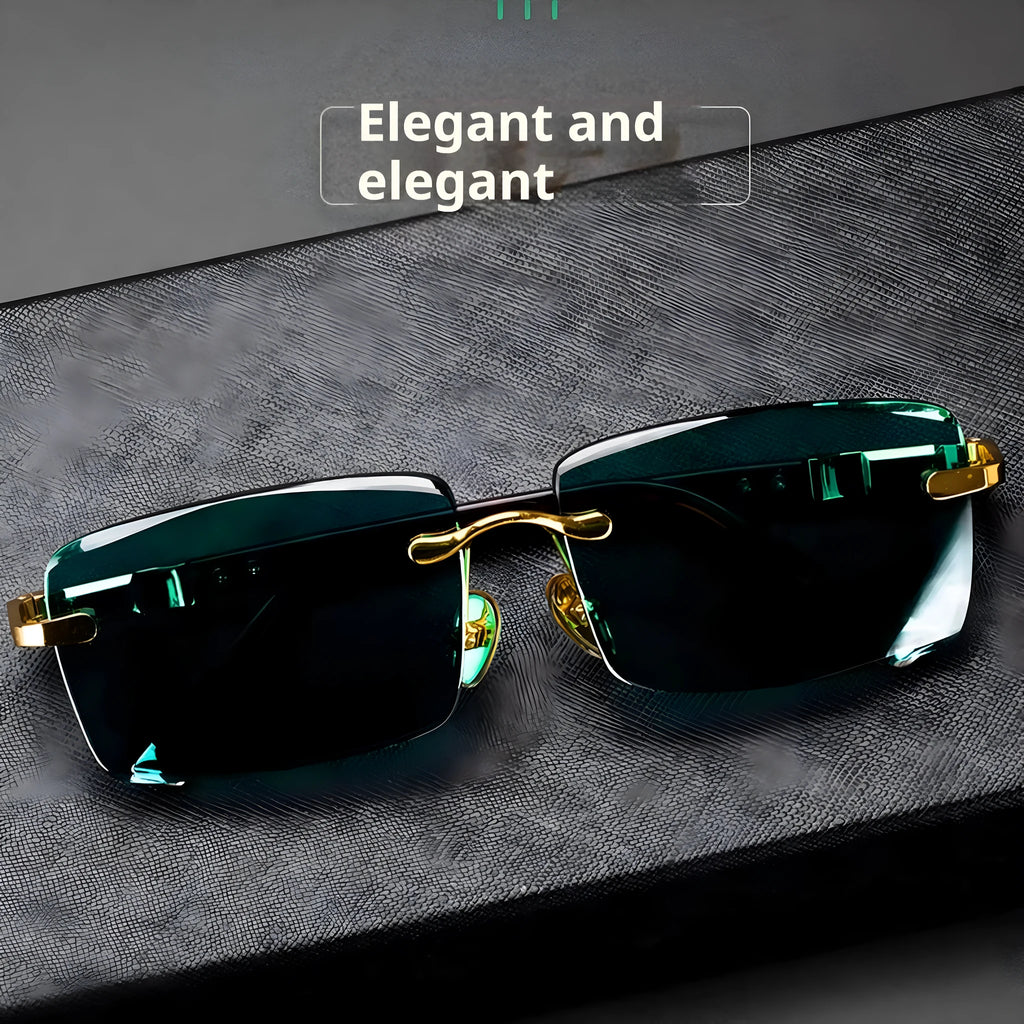 Frameless dark green crystal sunglasses shown with a glasses case and a lens cloth.