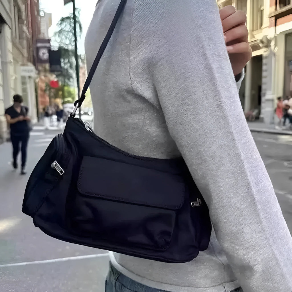 Black PU women's shoulder bag with side line detail, showing double pockets and measuring 24cm long.