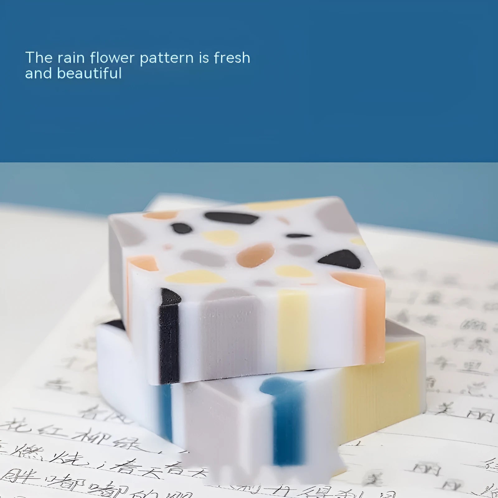 A rectangular brick-shaped white rubber eraser for removing pencil marks.