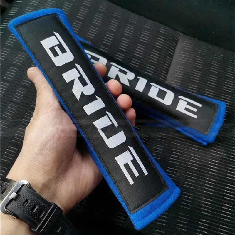 Pair of cotton car safety belt shoulder pads in black blue and red with embroidery