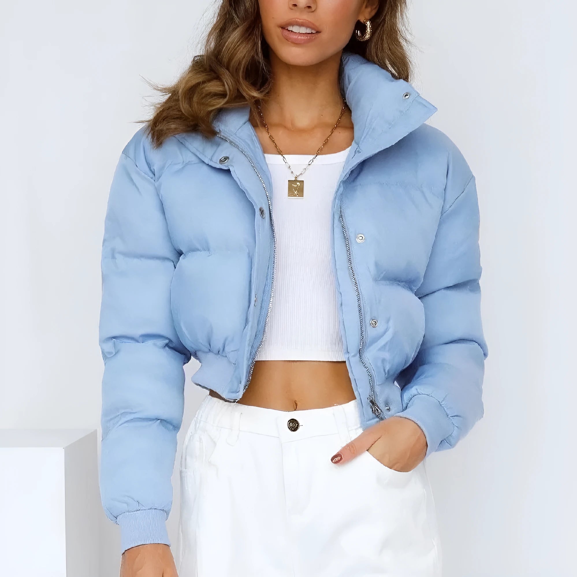 Women's loose blue polyester casual jacket with long sleeves on a hanger