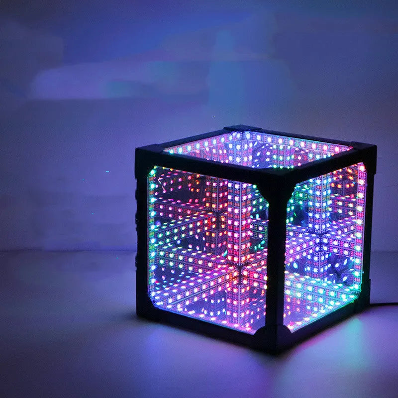 Thousand Mirrors 3D magic cube RGB LED lamp in black finish with remote control on desk