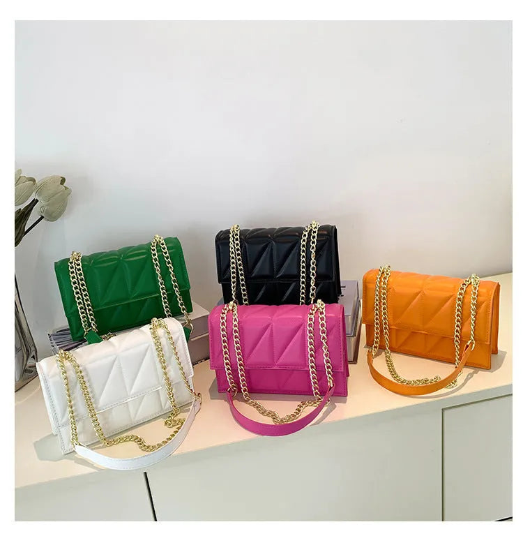 Small square PU chain crossbody bag in horizontal shape with spliced detail, available in five colours.