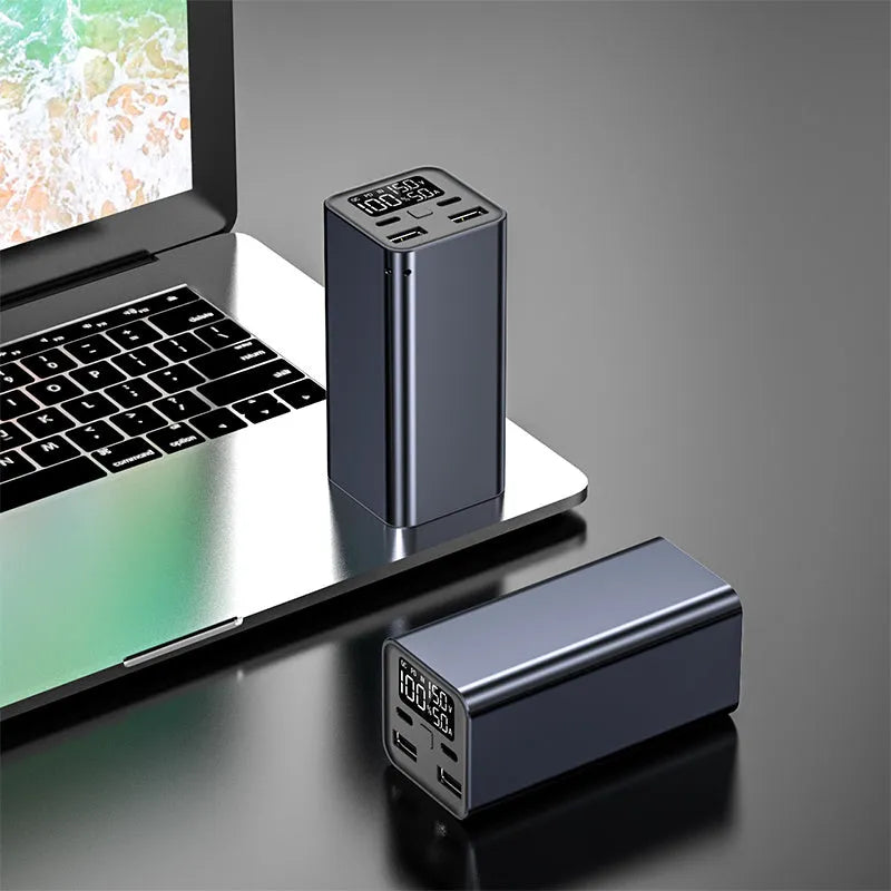 65W laptop power bank with metal casing in black, blue, or grey colours showing compact dimensions