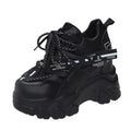 Women's white mesh platform sports shoes with cross strap and round toe on rubber sole.