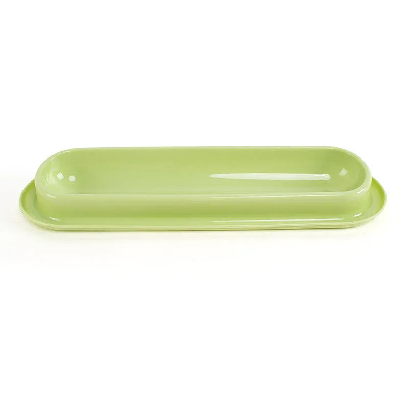 Green, pink and yellow leakproof pet food and water bowls for dogs and cats.