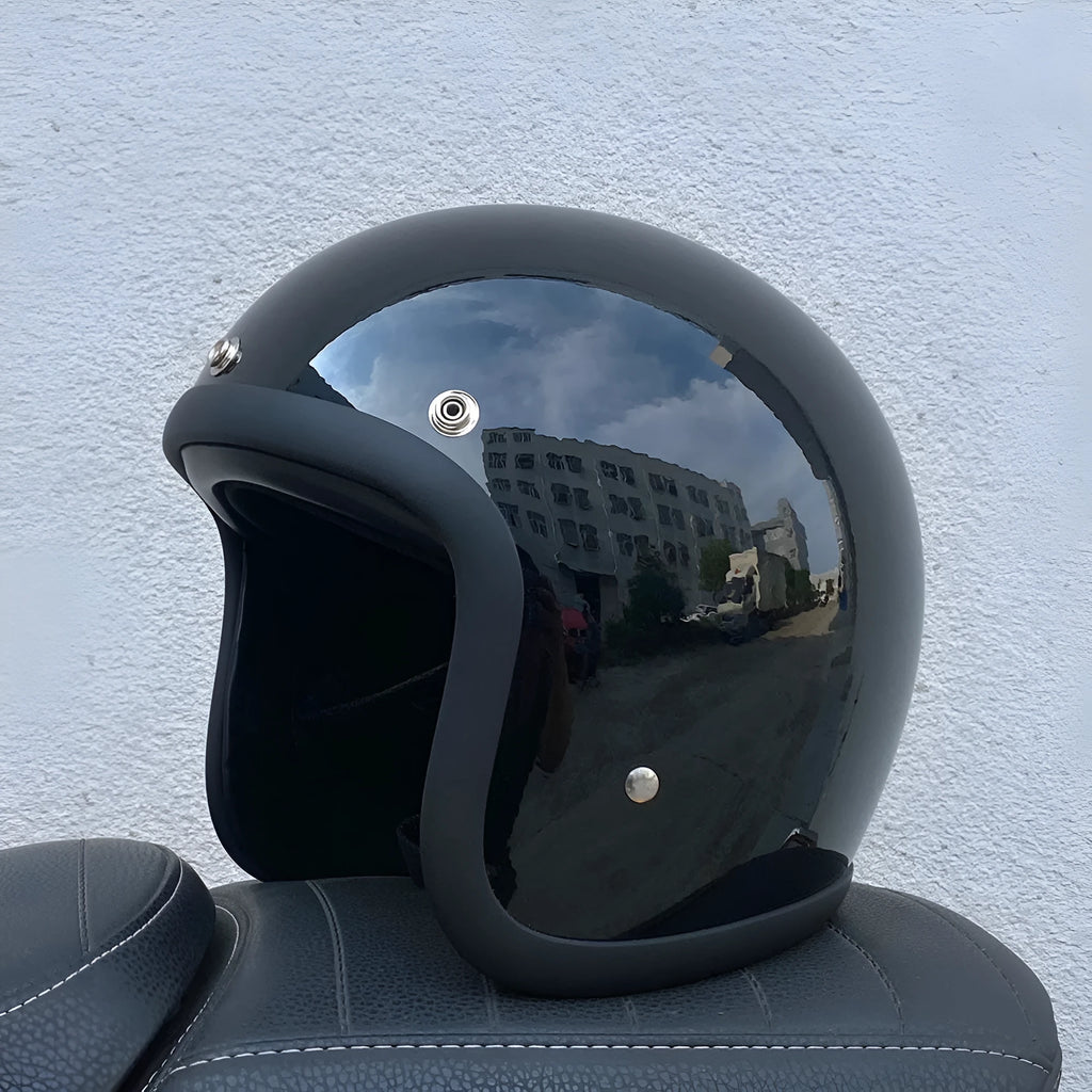 Glass fibre retro half motorcycle helmet shown in various colours including cement gray and matte black options