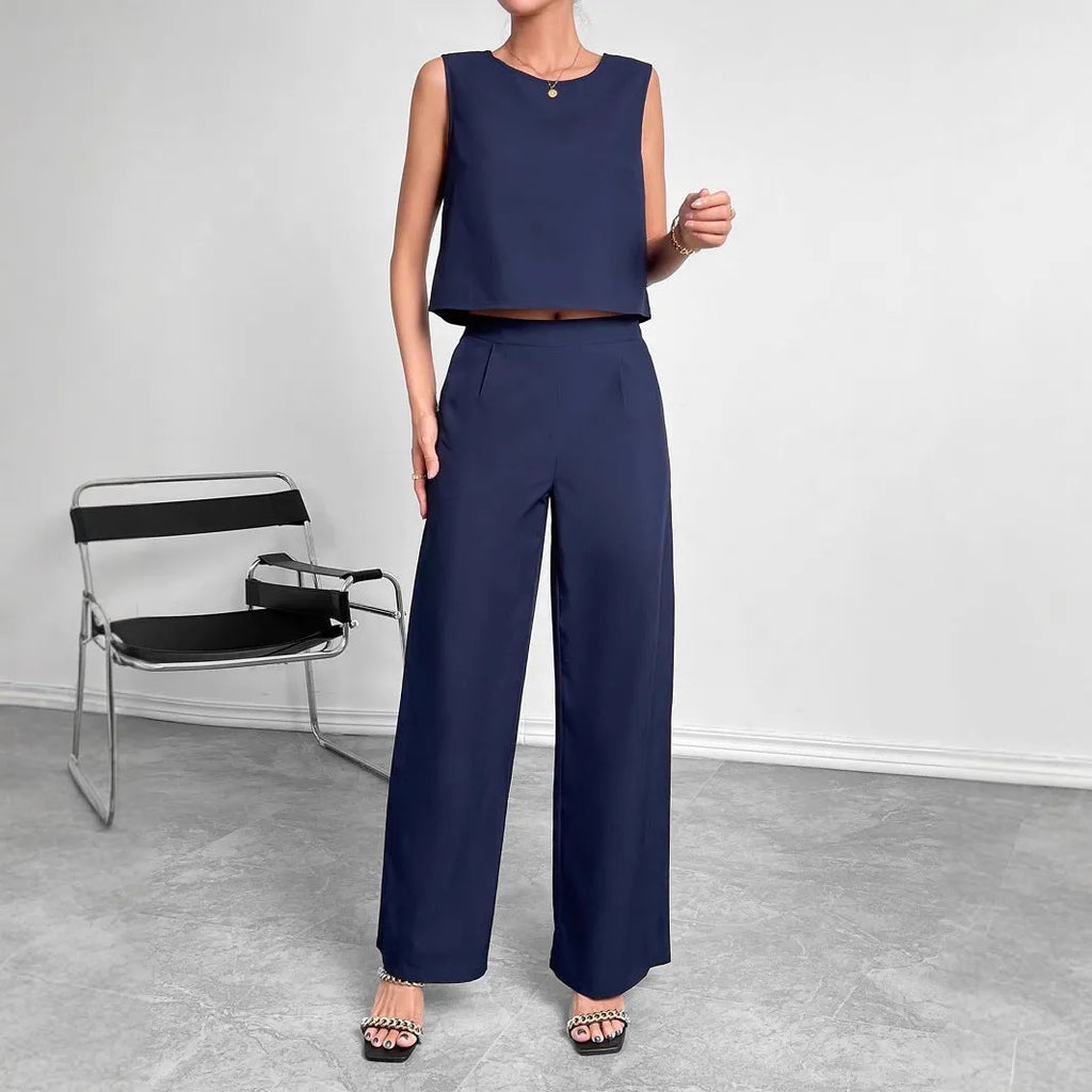 Red women's sleeveless top and wide leg trousers two-piece co-ord set on a hanger