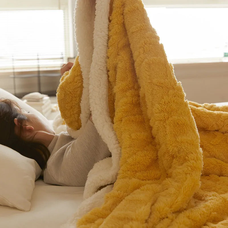 Polyester thermal flannel blanket in tea green colour, shown on a bed, size 180x200cm.