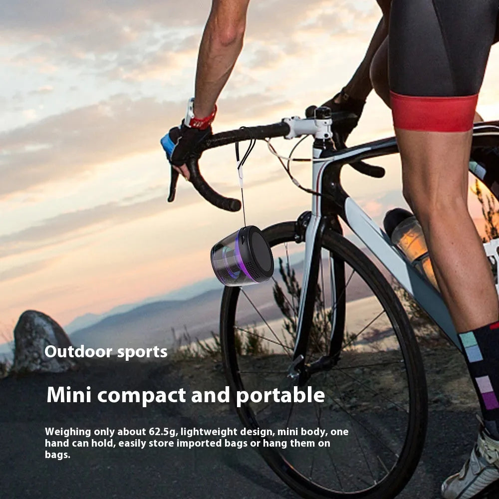 Portable wireless Bluetooth speaker with ambient lighting and magnetic base in black or white