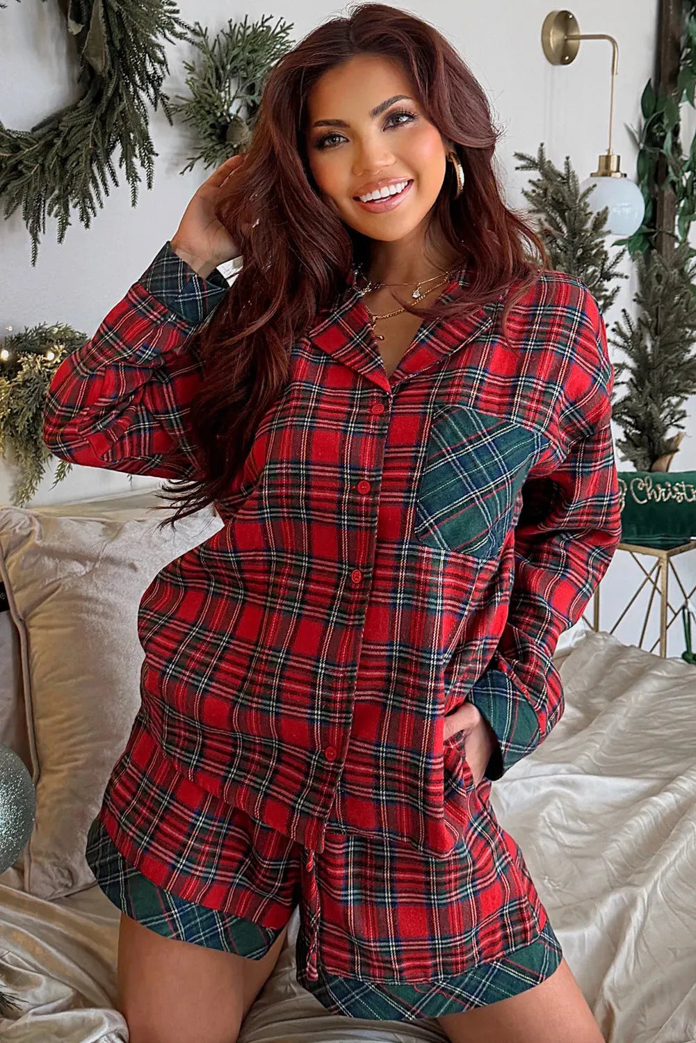 Red plaid Christmas pyjama set with long sleeve shirt and shorts featuring contrast patches
