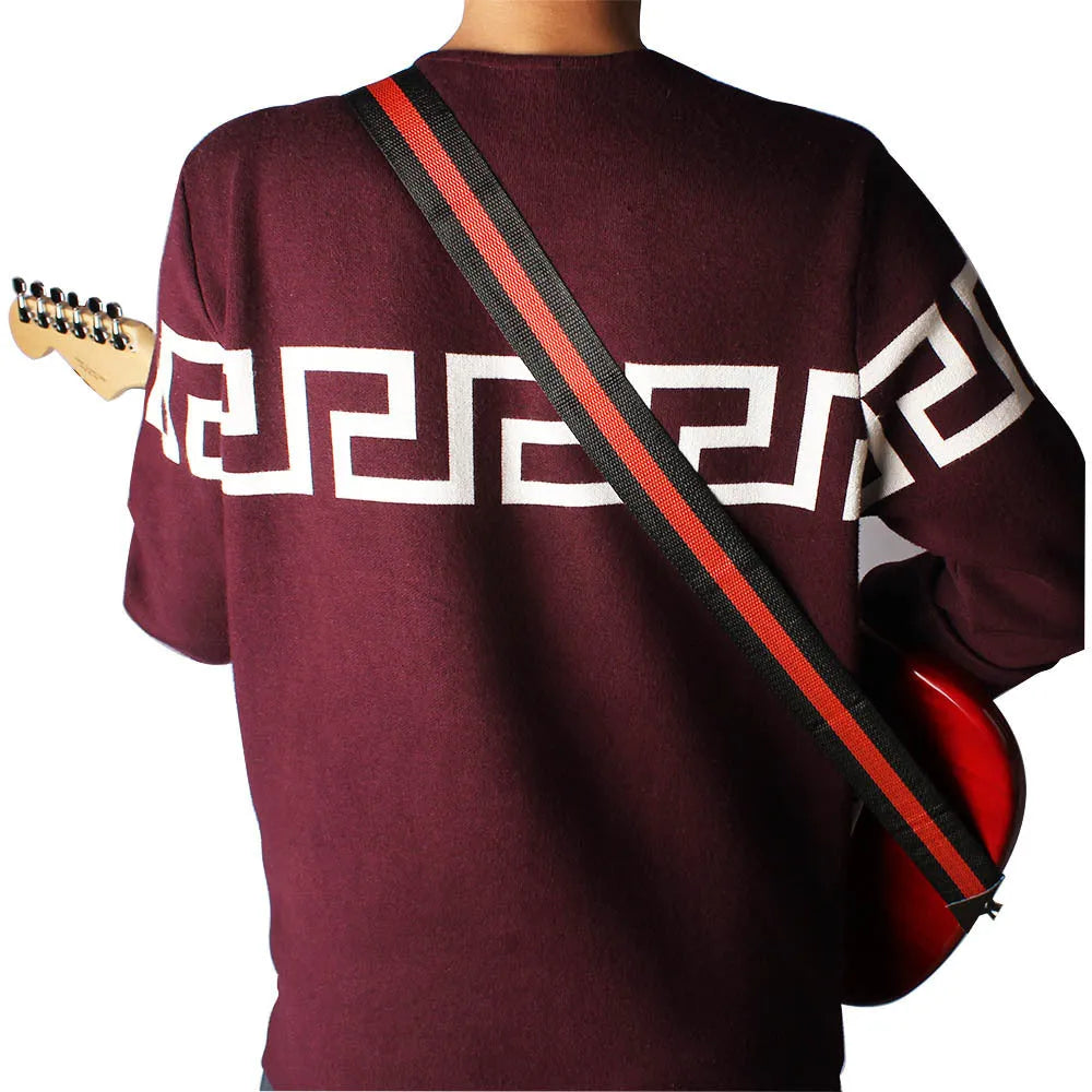 Woven crossbody instrument strap for guitars and ukuleles shown in multiple colour options.
