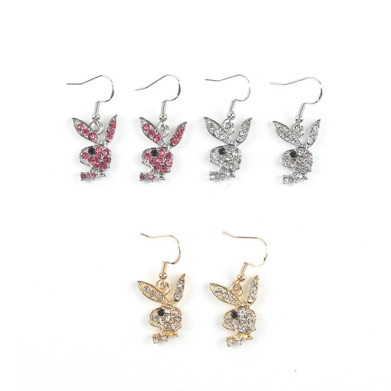 Close-up of cute rabbit stud earrings with full diamond face, in silver, pink, or gold alloy.