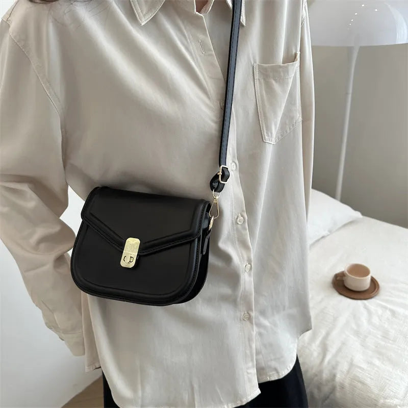 Soft PU leather messenger bag in clam shell design, shown in a horizontal square shape with a shoulder strap.
