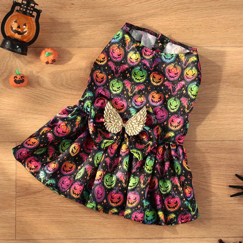 Bright orange pumpkin angel wings dog costume on a small dog, showing back wing design.