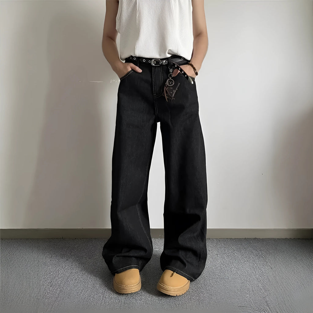 Black retro-style loose wide-leg straight-leg jeans on a hanger, showing mid-waist and zip fly.