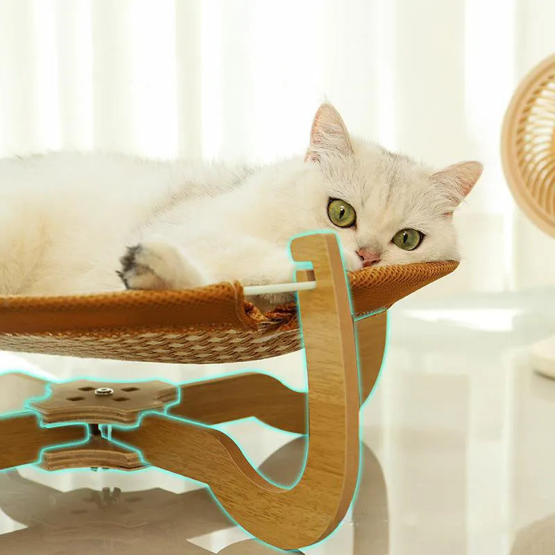 Brown woven rattan square pet bed basket for cats and small dogs on a wooden floor.
