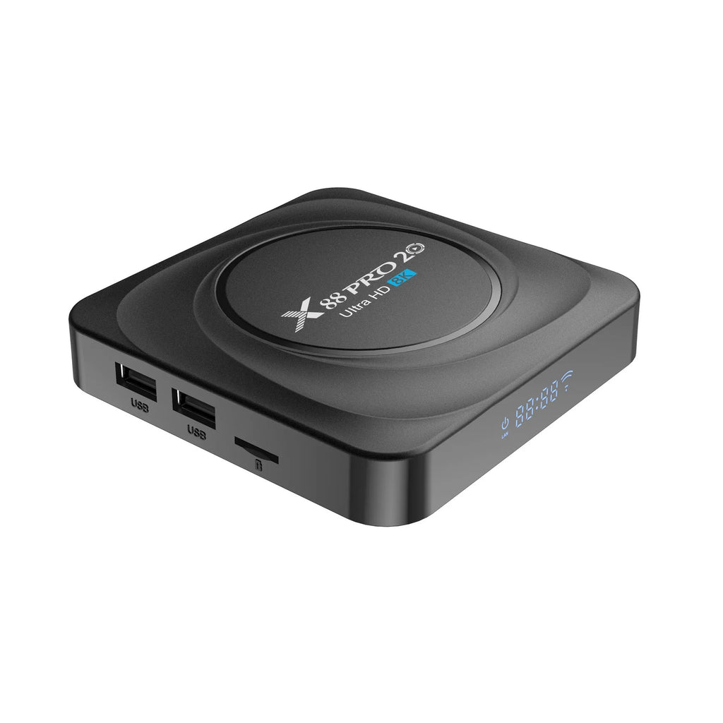 Android 11.0 set-top TV box with remote control and cables on a wooden table.