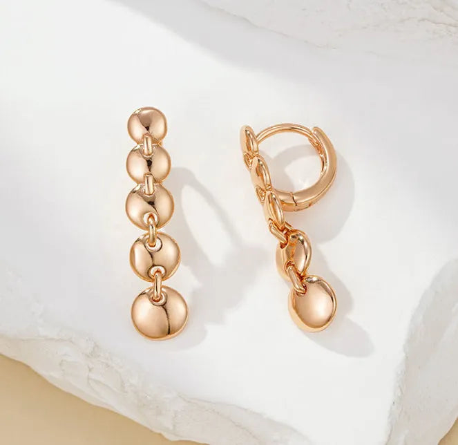 Gold-coloured retro circle earrings with 8cm diameter woven copper construction