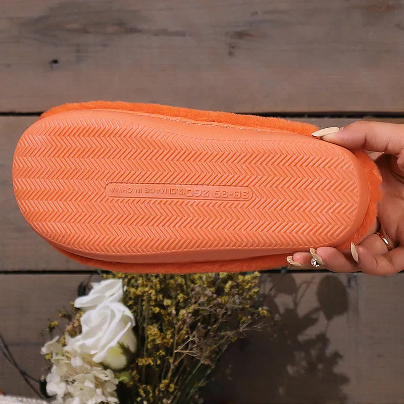 Orange Halloween pumpkin slippers with coral velvet upper and plush lining for indoor winter wear