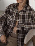Dark brown retro striped women's long sleeve cotton shirt shown on a hanger.