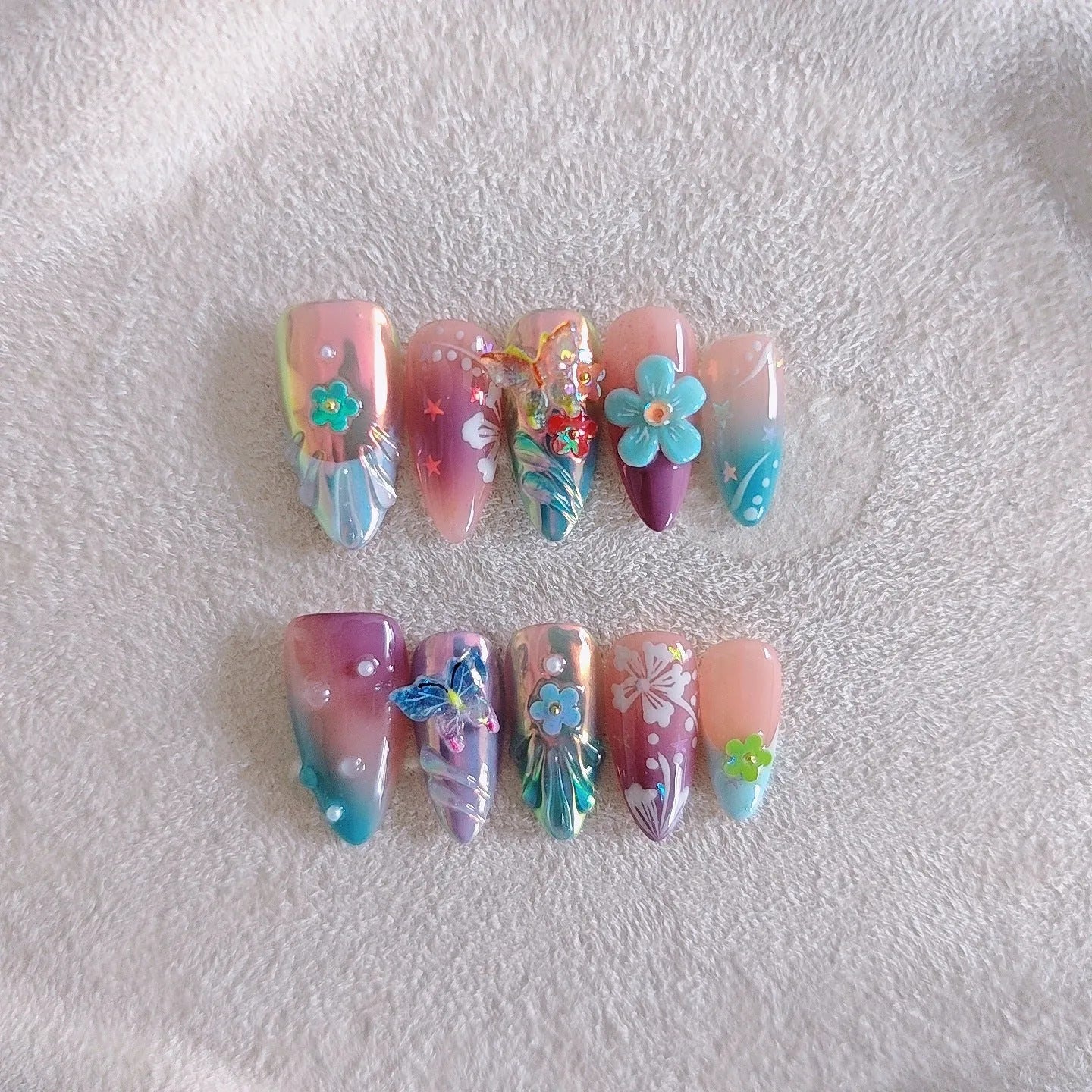 Handmade colourful small flower and butterfly sculpture manicure nails in floral patterns