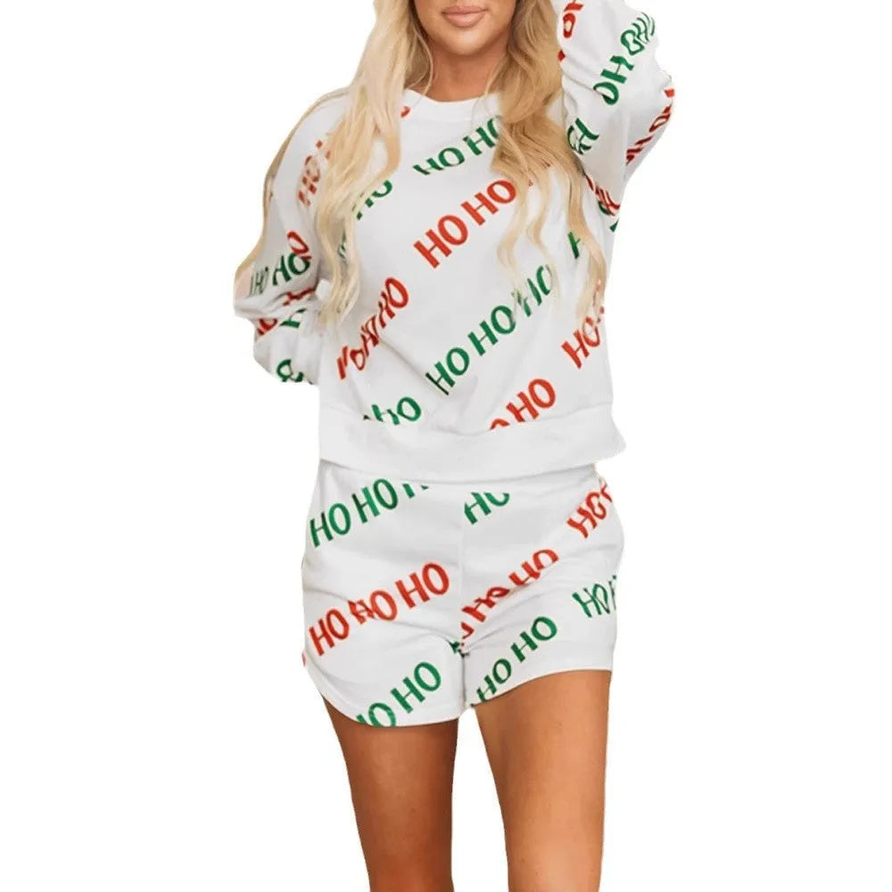 White women's two-piece suit with printed letters design, long sleeves, and matching trousers