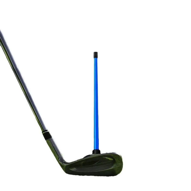 Red and blue aluminium alloy golf swing alignment trainer on a practice mat.