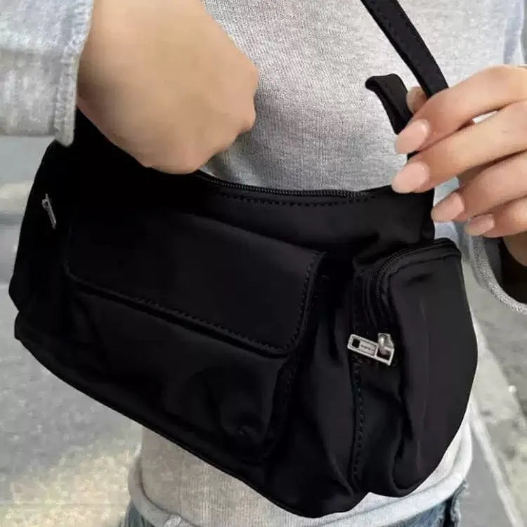 Black PU women's shoulder bag with side line detail, showing double pockets and measuring 24cm long.