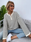 Women's black striped loose top with drop shoulders and button accents