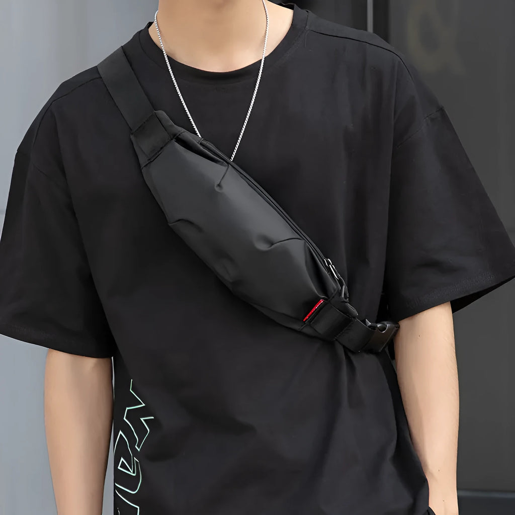 Black Oxford cloth waist pack with crossbody strap showing phone and ID pockets