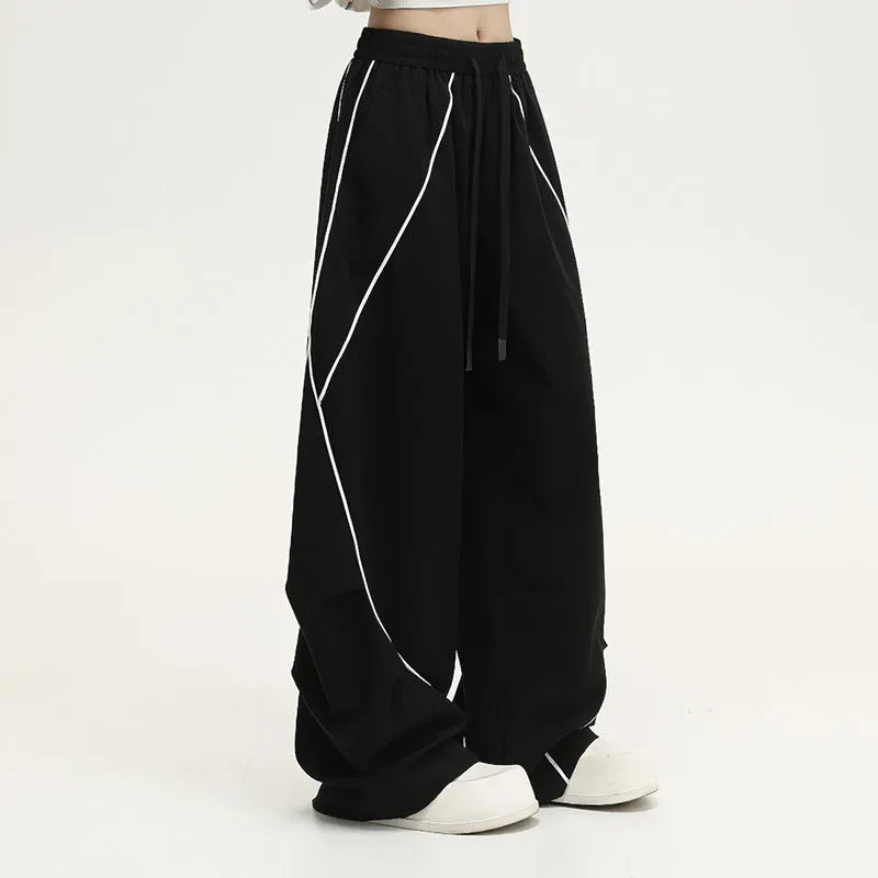 Black pleated wide-leg hip hop trousers with stripe pattern and mid waist cut