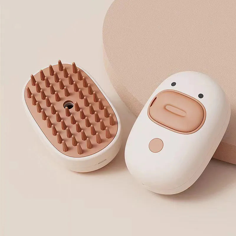White and yellow pet steam brush grooming tool with rubber teeth and a water tank.