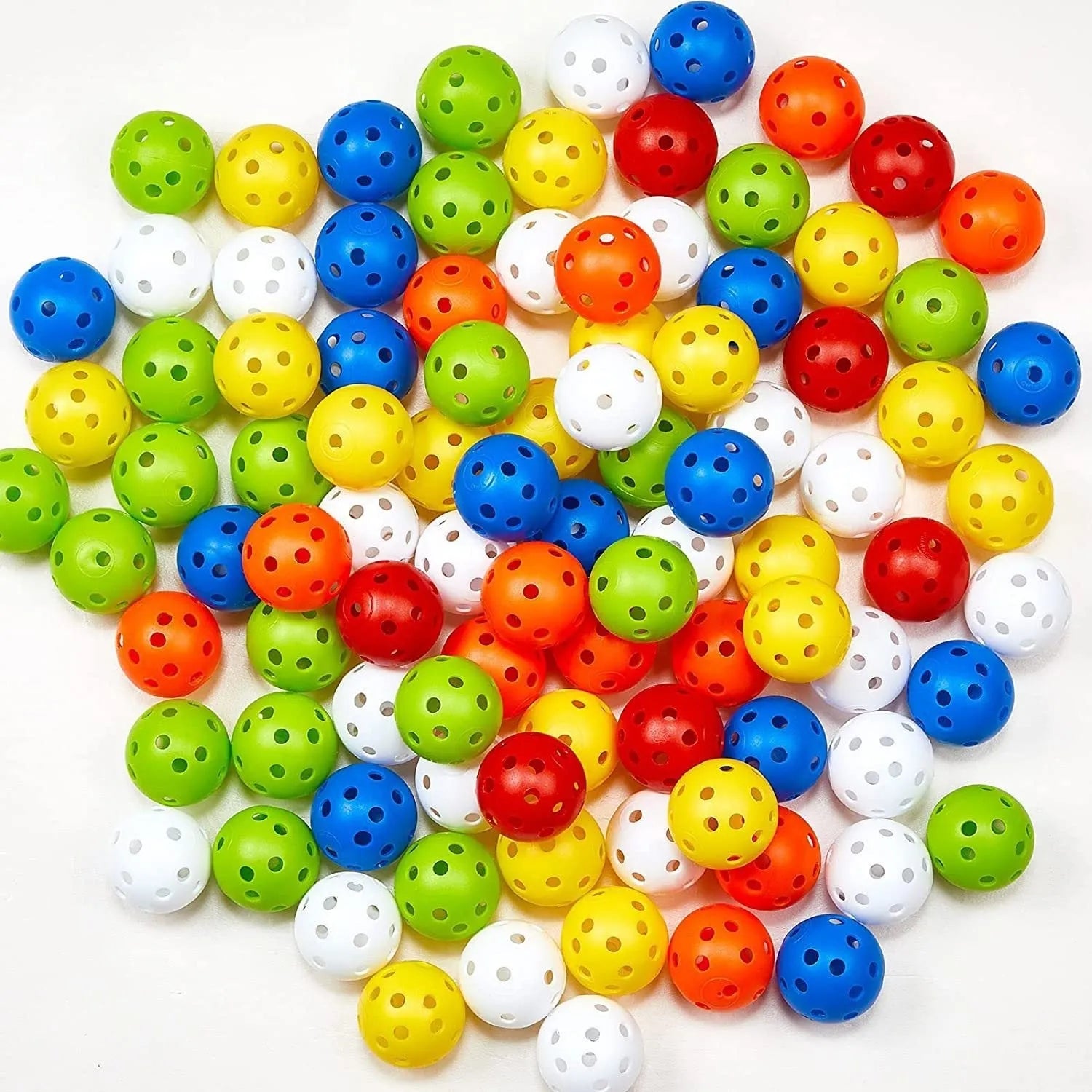 Multi-coloured golf practice balls in net storage pocket for putting training