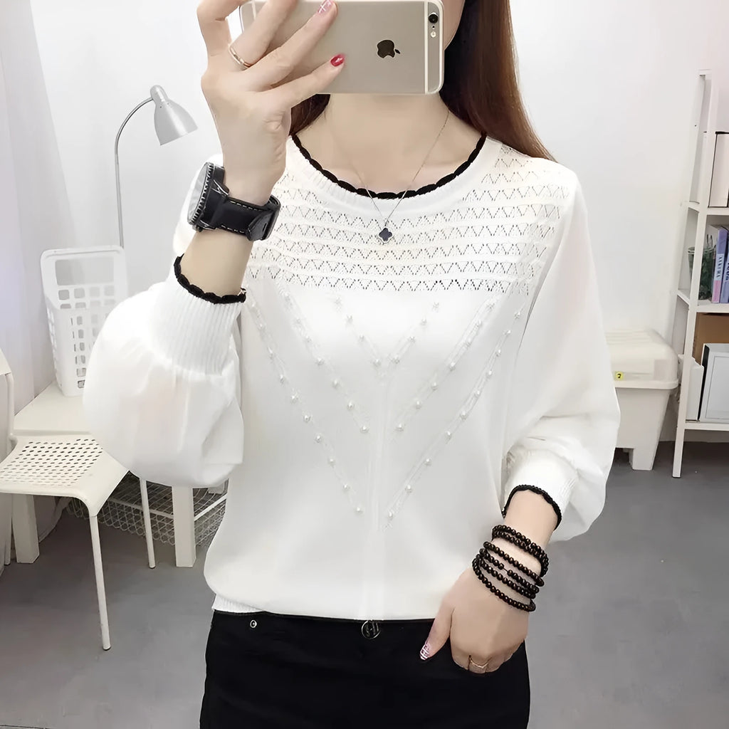 Loose-fit long sleeve round neck women's polyester top in solid colour, available in black, pink, and white.