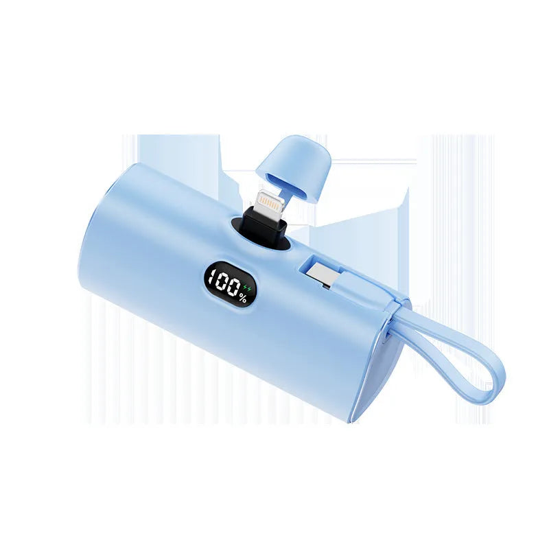 Compact wireless power bank with digital display showing battery percentage and built-in folding plug