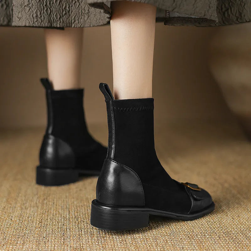 Women's black low heel lace-up Martin boots with round toe and rubber sole.