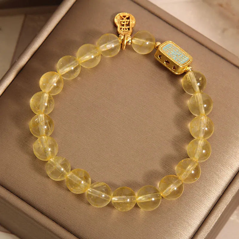 Women's natural yellow citrine crystal bracelet with decorative rhinestone elements