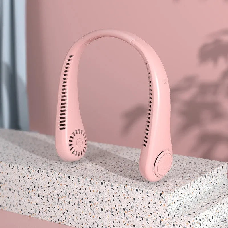 White USB rechargeable bladeless neck fan being worn, showing soft silicone neckband and compact design.