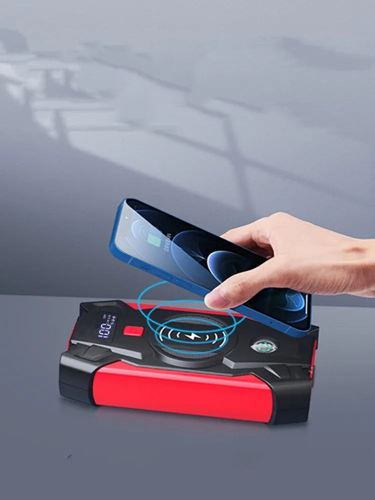 Red car emergency jump starter with thick battery clips and storage box showing 39800W power rating